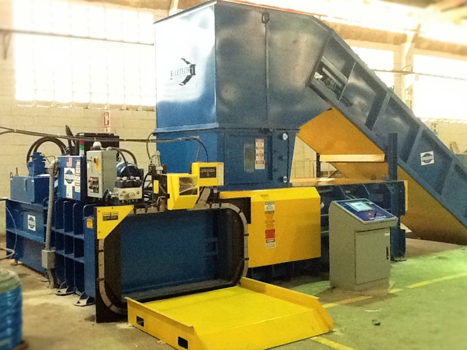 a large custom baler system set up inside a factory